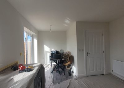 Dining area before decorating, dust sheets down