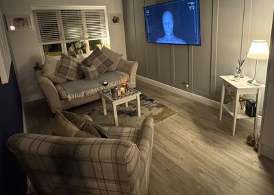 Living room after decorating, grey panelled feature wall